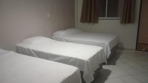 Pousada Ponta Negra客房内的一张或多张床位