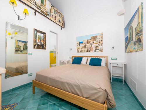 波西塔诺Artist House in Positano的卧室配有一张床