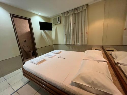Hotel Bariloche Tijuca Adult Only客房内的一张或多张床位
