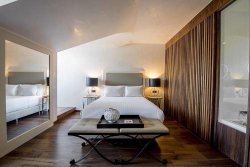 贝萨酒店－力比达德客房内的一张或多张床位