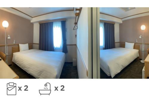 釜山釜山西面托优克酒店的酒店客房设有两张床和窗户。