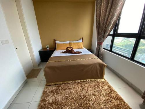CheeAyu@ Putrajaya IOI Resort客房内的一张或多张床位