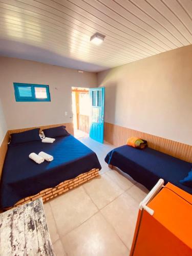 帕赖帕巴LagoinhaKitePoint的一间卧室,配有两张床