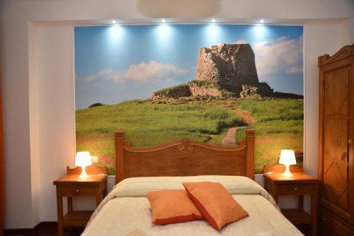 努奥罗B&B LE DUE ISOLE的一间卧室,配有城堡的大画