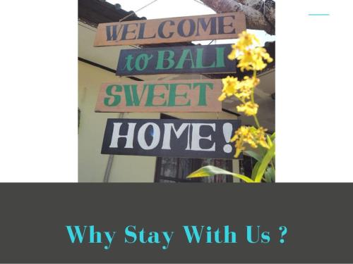 塔巴南Coliving Bali SWEET HOME Kost Lengkap di Tabanan Kota的表示欢迎在甜蜜的家和花上打球的标志
