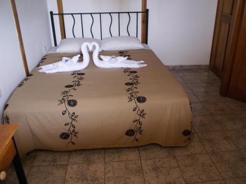 Hotel Posada Los Delfines客房内的一张或多张床位
