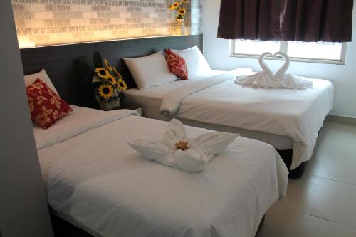 签名酒店@南孟沙客房内的一张或多张床位