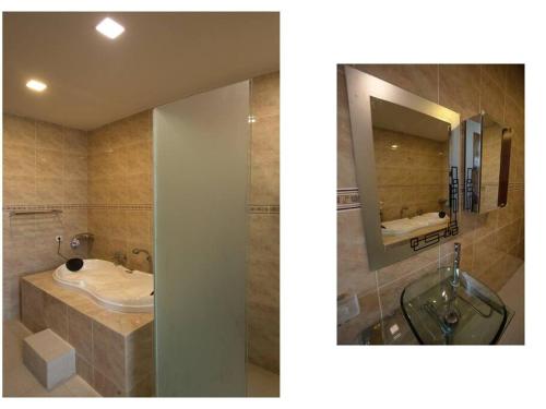 丹戎Dawn Light Villa, Sire的一间带水槽和镜子的浴室