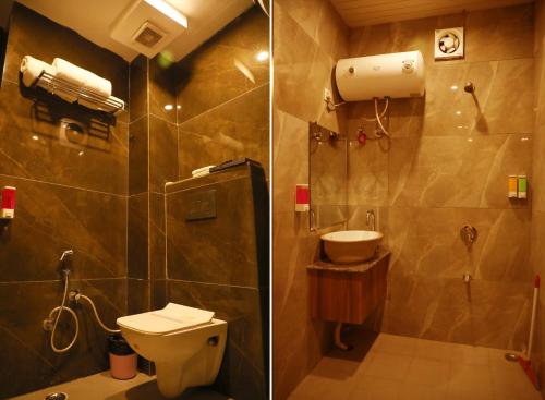 哈里瓦Hotel Ganga Heights的浴室配有卫生间、淋浴和盥洗盆。