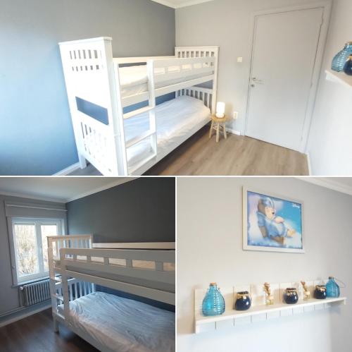 德帕内Vakantievilla Het Dunehuys的卧室配有两张双层床,一张照片