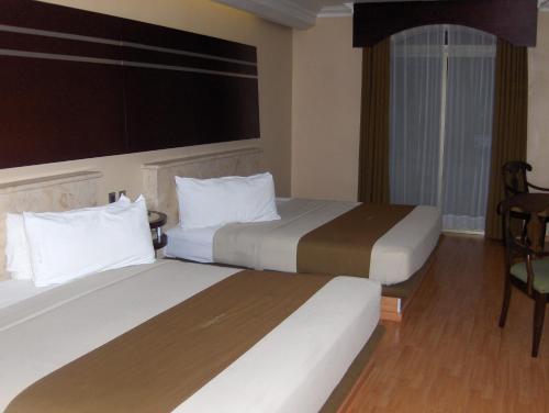 杜布罗夫尼克酒店客房内的一张或多张床位