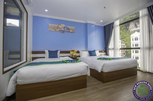 吉婆岛吉婆岛旅馆的卧室设有两张床铺,拥有蓝色的墙壁