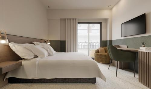 卡拉马塔Evripidou 7 - Kalamata Mediterranean Suites的卧室配有一张白色大床和一张书桌