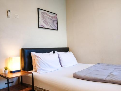 Sleep House 2BR Wifi Unlimited客房内的一张或多张床位
