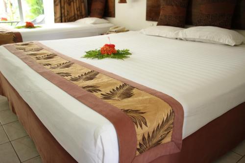 魔蝎座国际酒店客房内的一张或多张床位