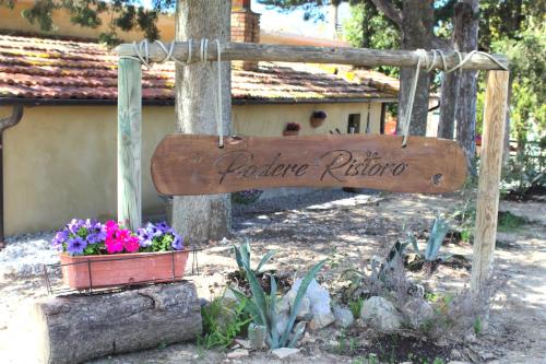 圣焦万尼达索Casa vacanza Podere Ristoro的花盆花园的标志