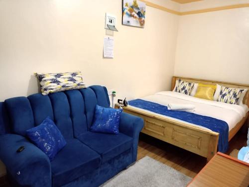 Essie Studios Naivasha CBD客房内的一张或多张床位