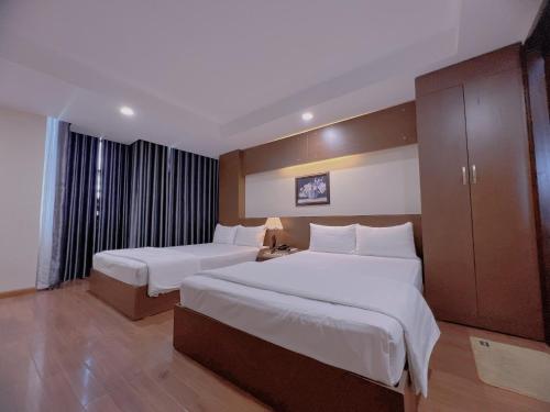 Nha Trang Crystal Hotel客房内的一张或多张床位
