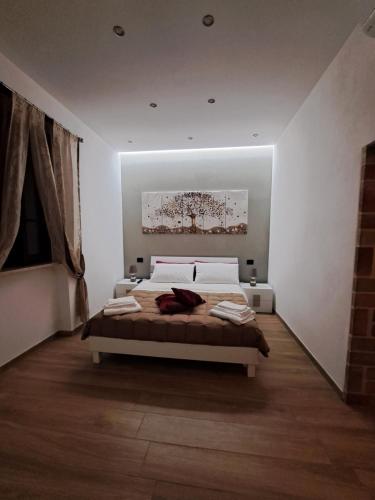 帕尔蒂尼科Colle del Re Sicily的一间卧室,卧室内配有一张大床