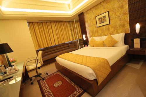 加尔各答雷根塔欧克斯皇家兰花有限酒店客房内的一张或多张床位