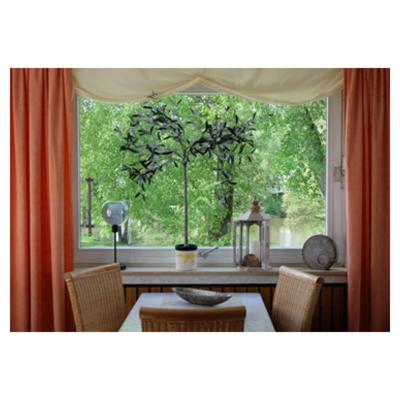 霍恩-巴特迈恩贝格Haus am See的一间带桌子和大窗户的用餐室