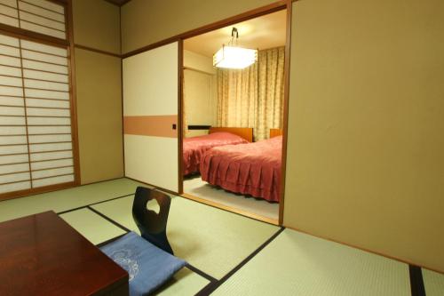 Imakuni Ryokan客房内的一张或多张床位