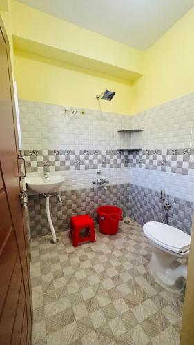 奇克马格尔Navile Apartments的浴室配有白色卫生间和盥洗盆。