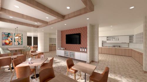 萨克拉门托Hyatt House Sacramento Airport - Natomas的一间带桌椅的用餐室和一间厨房