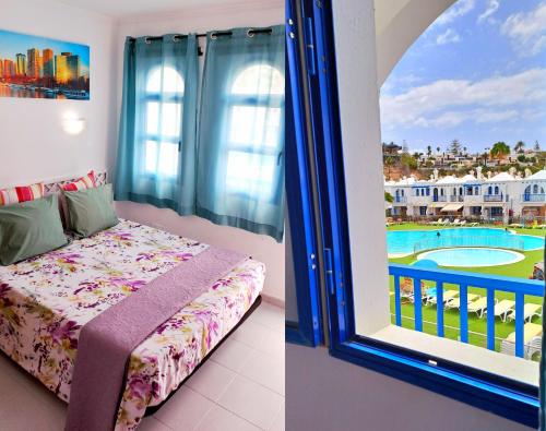 马斯帕洛马斯BungaLove Maspalomas的一间卧室设有一张床和一个带游泳池的窗户