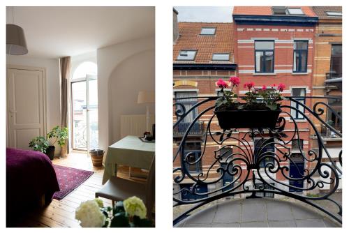 布鲁塞尔Ambiorix Residence的客房设有带鲜花的锻铁栏杆阳台