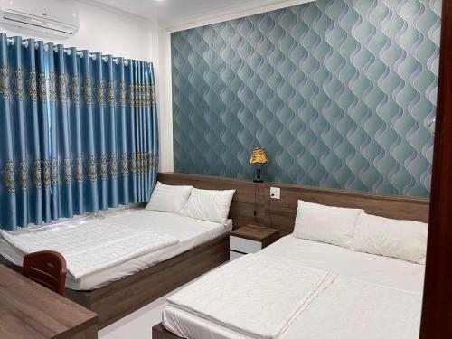 Kim Ngân Motel客房内的一张或多张床位