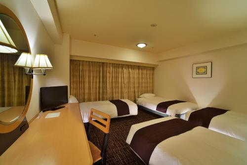 福冈运河城华盛顿酒店客房内的一张或多张床位