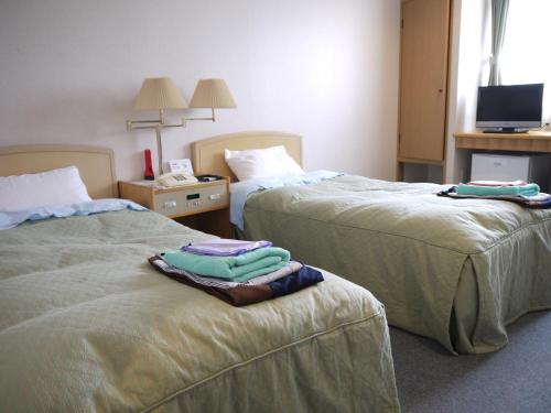 川汤KKR酒店客房内的一张或多张床位