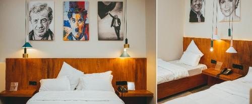 布琼布拉Burundi Palace Boutique Hotel的酒店客房设有两张床,墙上挂有照片