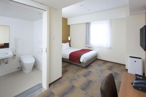福尔克罗三里库酒店客房内的一张或多张床位