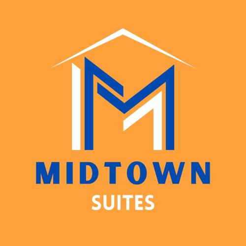 格林维尔Midtown Suites - Greenville的中城套房的新标志