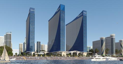 巴统Aparthotel Georgia的一群高大的建筑,在城市里,有帆船