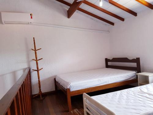 Recanto Vizinho do Mar客房内的一张或多张床位