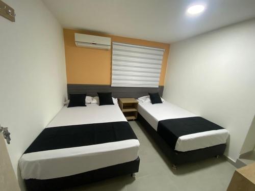 HOTEL ESTADIO DORADO客房内的一张或多张床位