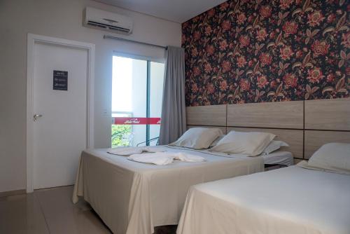 佩尼亚HN-Hotel Natal Penha的一张壁纸,一张床铺