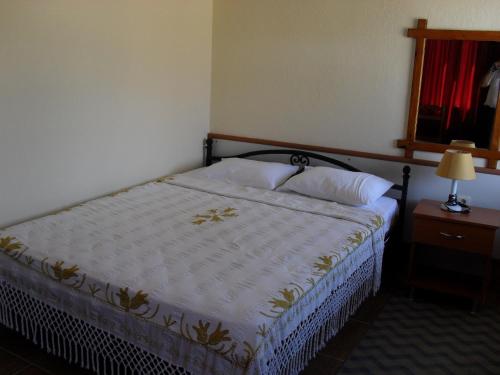 奥扎尔普别墅公寓酒店客房内的一张或多张床位