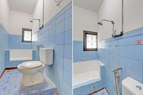日惹SPOT ON 92623 Mw 46 Guesthouse的蓝色和白色的浴室设有卫生间和浴缸。