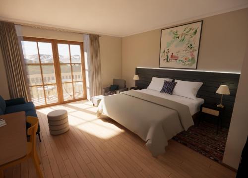 基茨比厄尔HENRI Country House Kitzbühel的卧室设有白色的床和大窗户