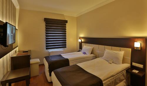 Gaziantep Garni Hotel客房内的一张或多张床位