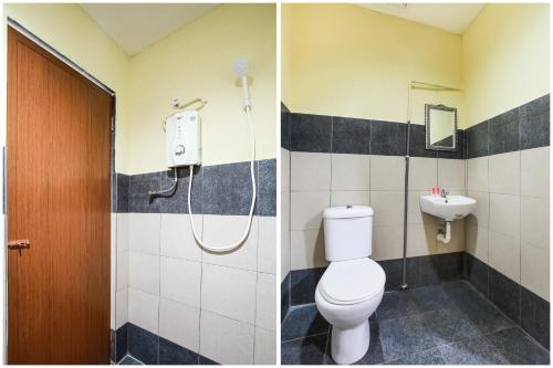 万津Happy Inn Hotel的带淋浴、卫生间和盥洗盆的浴室