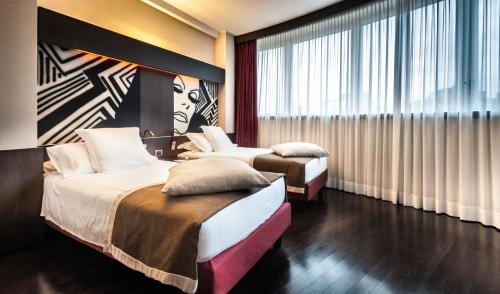 米兰皇冠广场酒店客房内的一张或多张床位