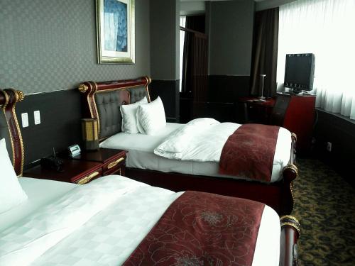 金大使熊谷酒店客房内的一张或多张床位