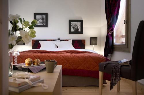 勒吉加纳CGH公寓式酒店客房内的一张或多张床位
