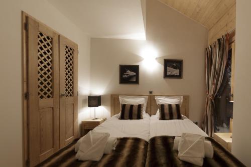CGH拿破仑Spa公寓客房内的一张或多张床位