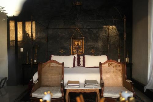 Coqui Coqui Casa de los Santos Izamal - THE ONLY ONE SUITE COLLECTION客房内的一张或多张床位